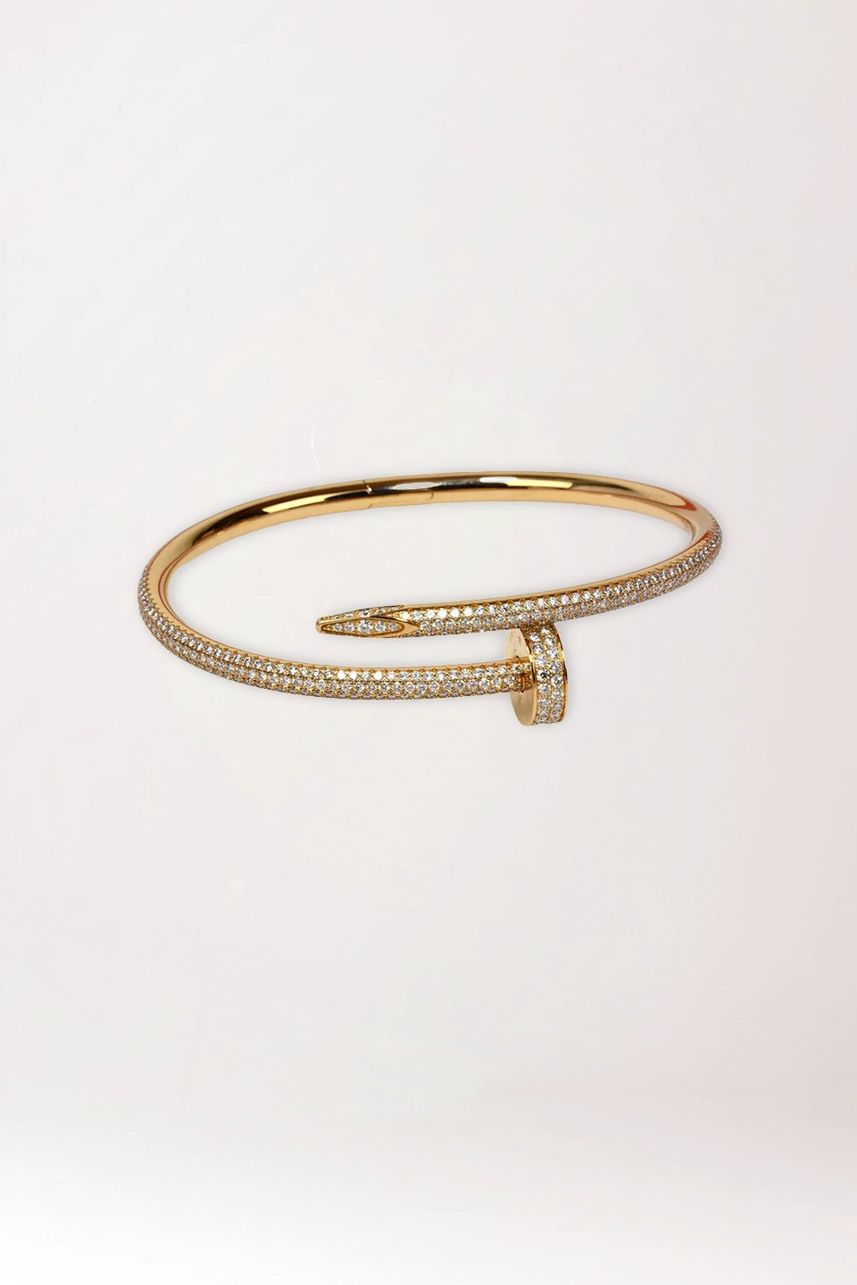 Pulsera clavo dorada de acero y circonitas