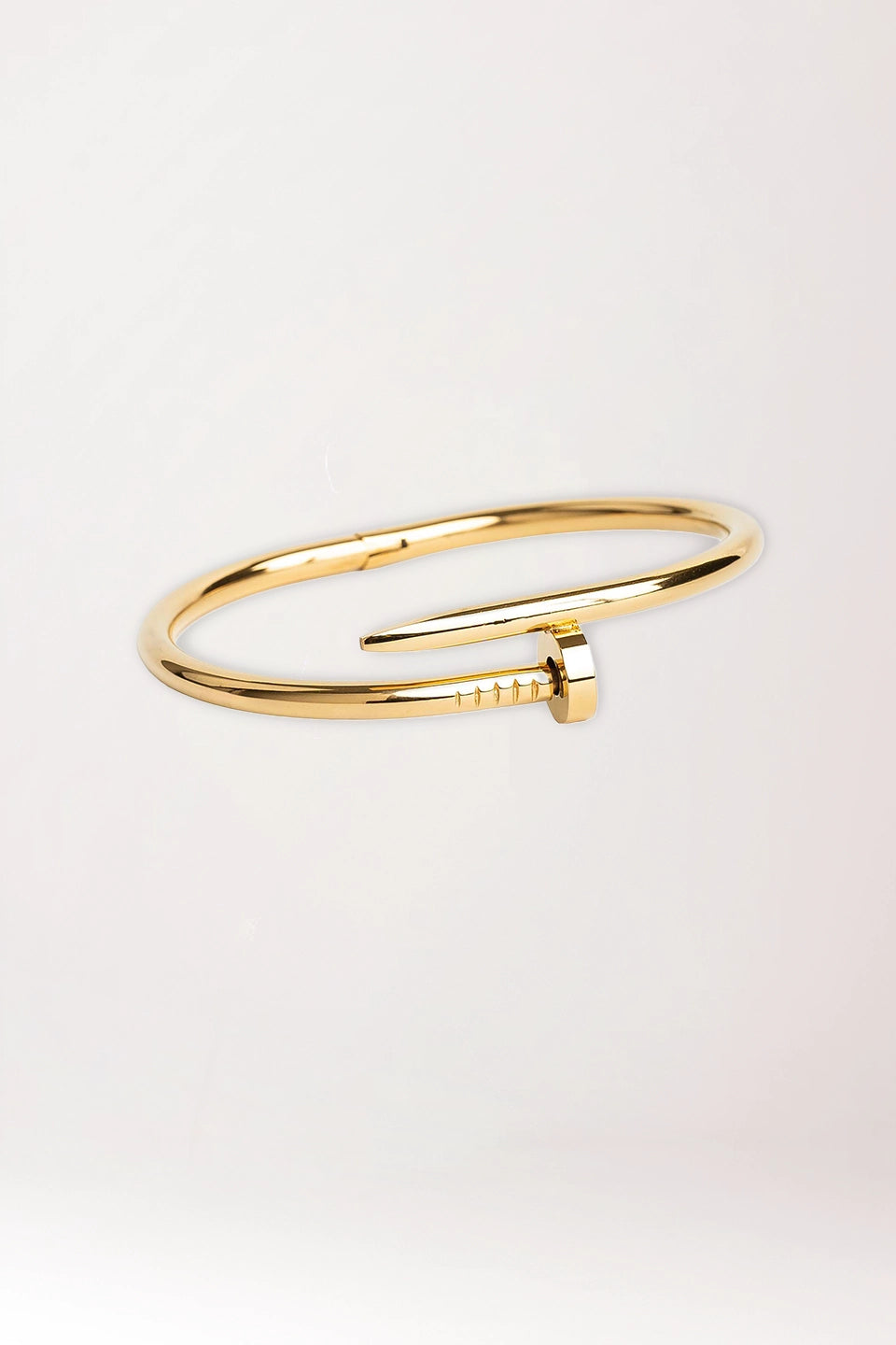 Pulsera clavo dorada de acero