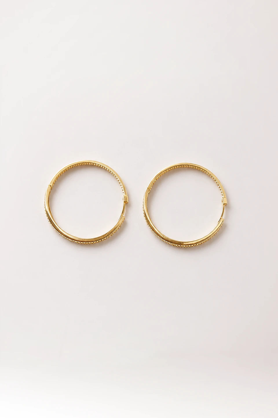 Argollas en plata de ley rodiada 925 con baño de oro